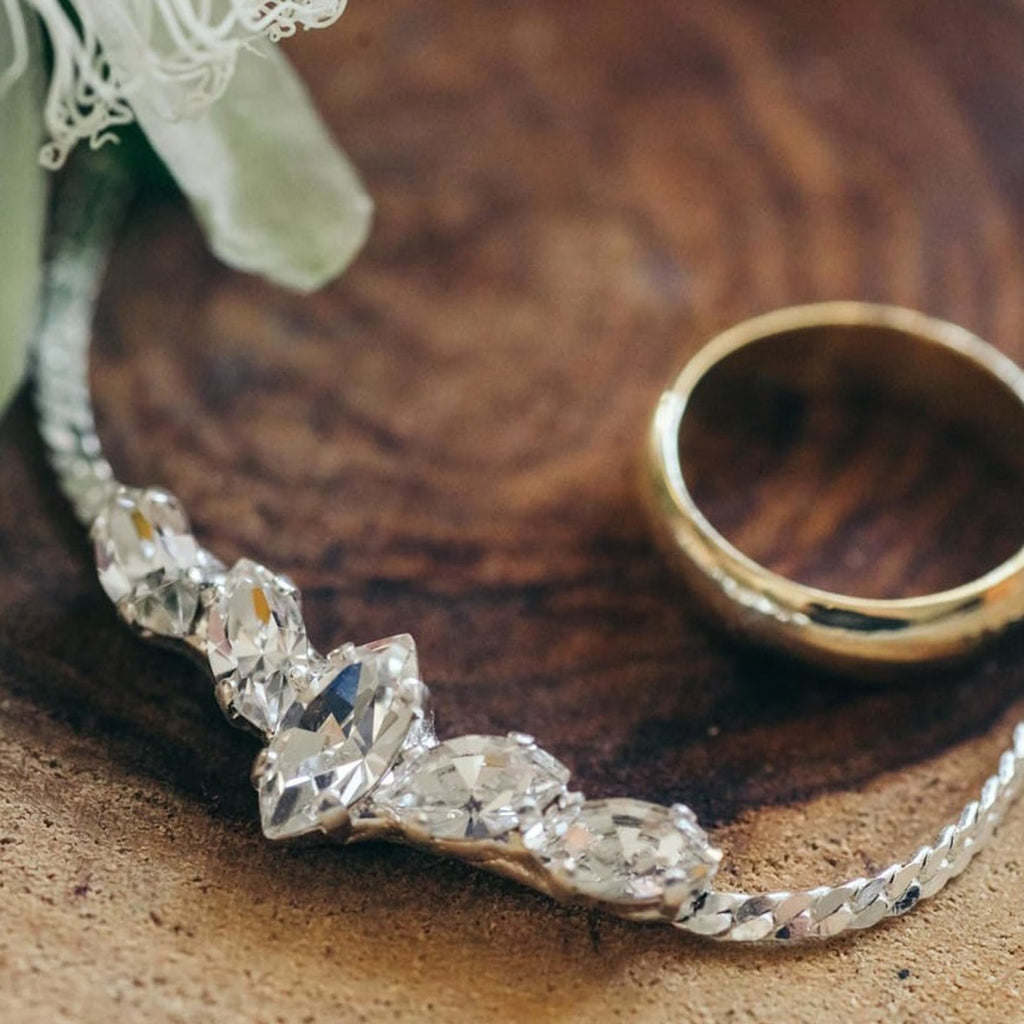 Premium Photo | Girl put a bracelet on arm bride putting on jewelry focus  on bracelet bridal preparation for the wedding ceremony